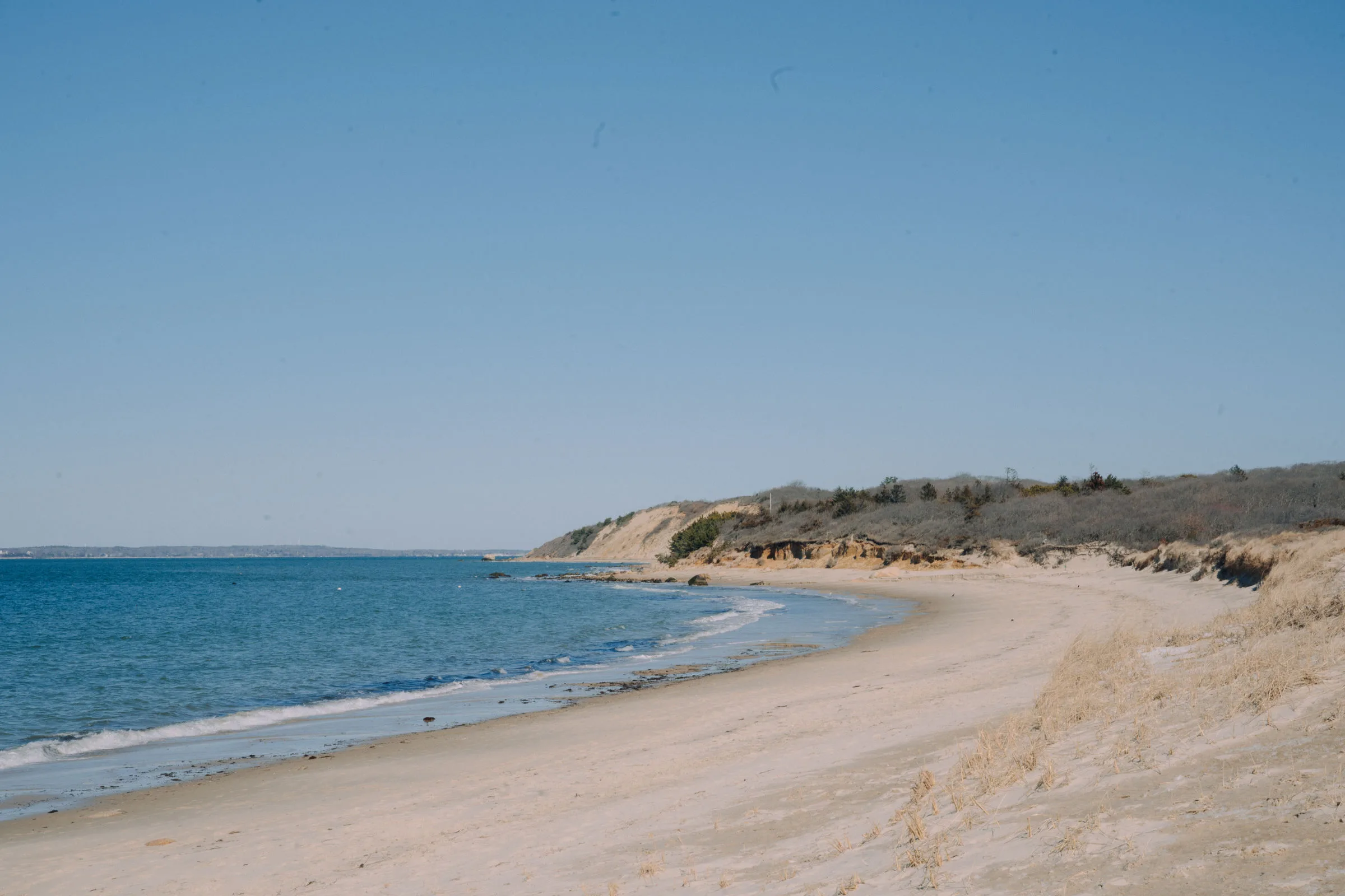Quiet Lambert's Cove beach in the off-season with empty sand and winter dunes